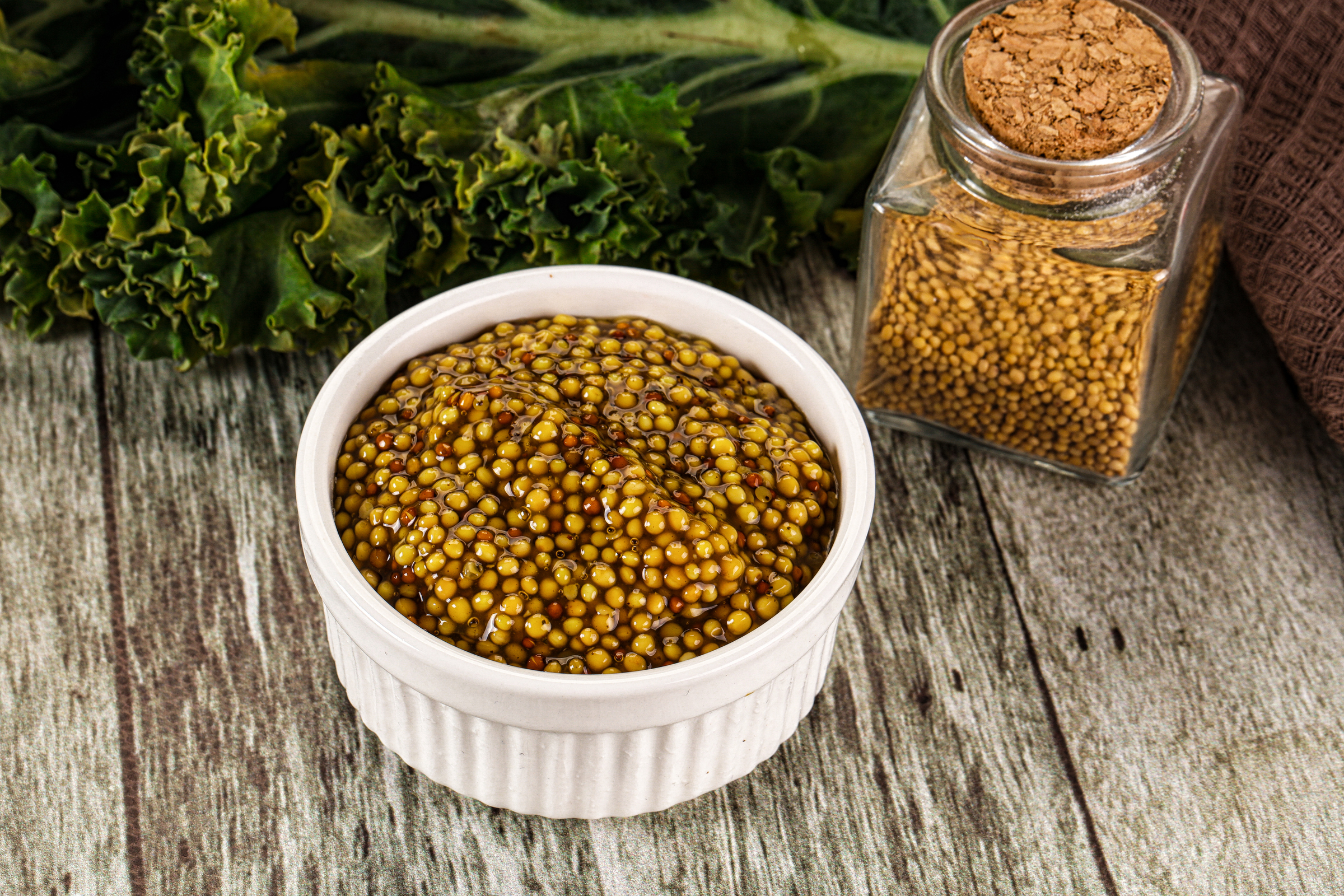 large vecteezy_a bowl of mustard seeds and a bottle of mustard_57941523_large