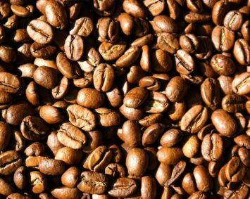 High-resolution close-up of roasted Arabica coffee beans showing intricate textures.