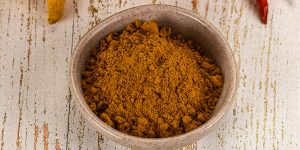 Indian cuisine - curry powder for culinary in the bowl