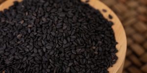 large-vecteezy_black-sesame-in-a-wooden-cup-placed-on-a-bamboo-weave_34731008_large