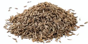 Cumin seeds. Pile of cumin seeds or caraway isolated on white background