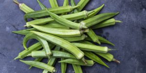 Fresh organic vegetables Lady's Finger or Okra on the Dark concrete floor