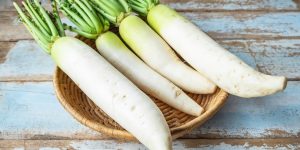 Fresh radish in a wooden basket