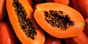 Papaya, halves of fresh juicy orange tropical fruit.